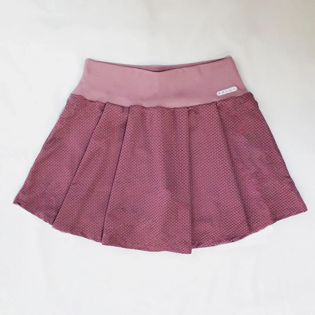 Pollera de mesh dry texturizado con tablas y ciclista de súplex low compression de pretina ancha, color morado claro