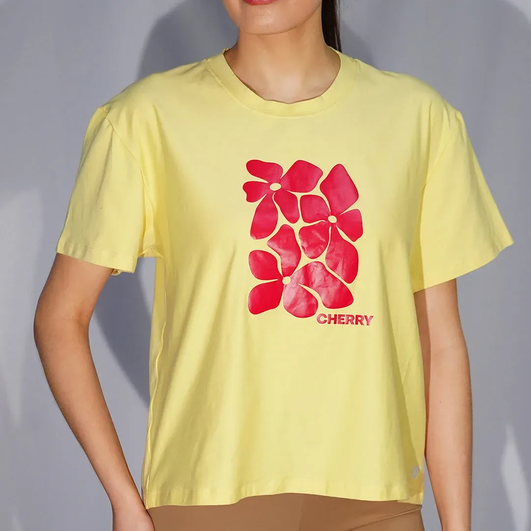 Remera de lycra de algodón oversize de cuello redondo y mangas caídas con serigrafía en delantero, color amarillo